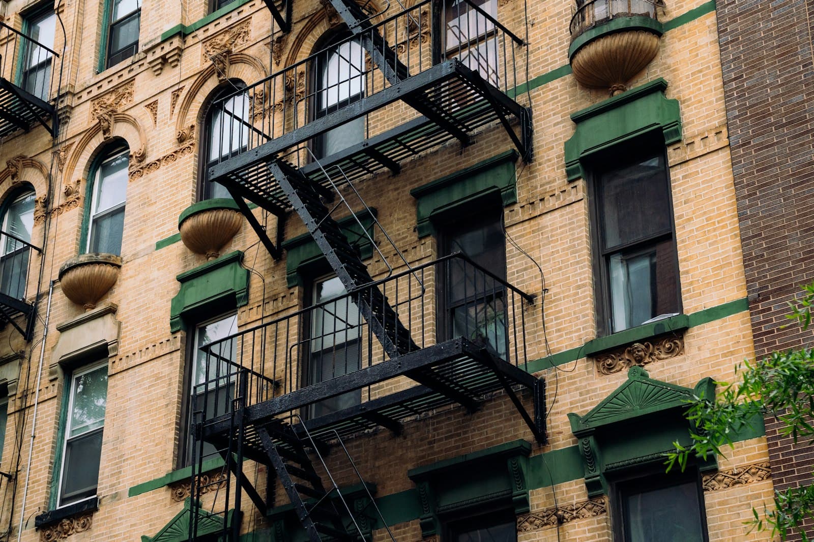 Prewar New York apartment building facade — the kind of managed building that requires a COI before movers can enter